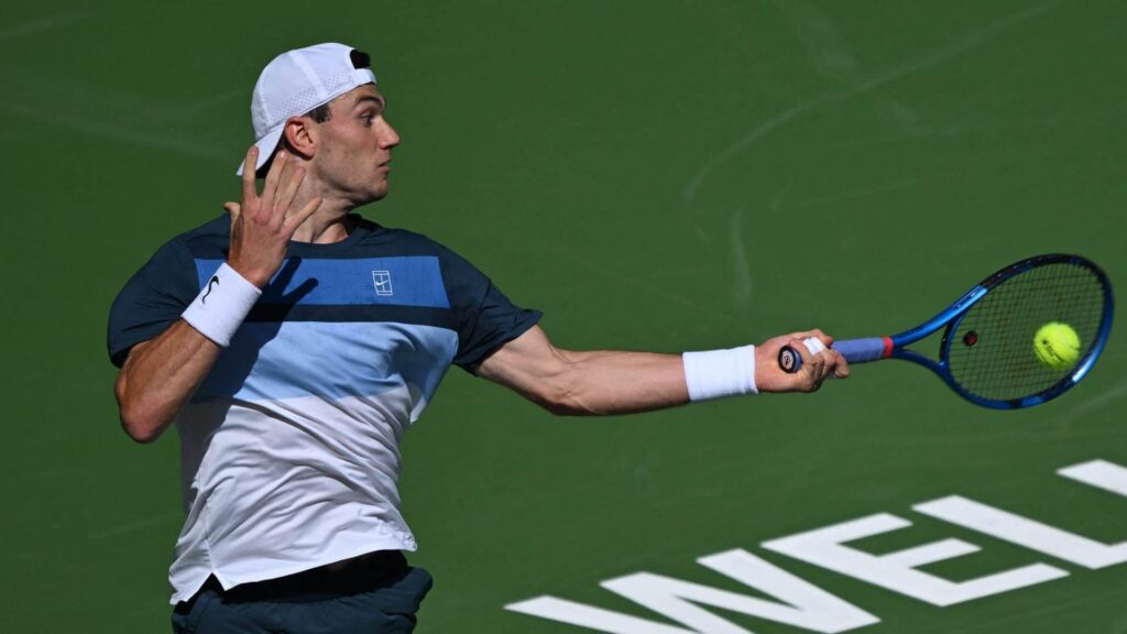 Britain's Jack Draper hits a shot against Denmark's Holger Rune in their BNP Paribas men's final on Sunday, Draper cops Indian Wells title