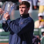 Britain's Jack Draper holds the troophy aftyer the BNP Paribas Open final on Sunday, Draper cops Indian Wells title