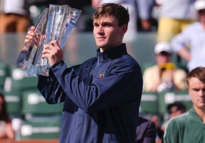 Britain's Jack Draper holds the troophy aftyer the BNP Paribas Open final on Sunday, Draper cops Indian Wells title