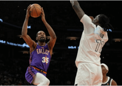 Phoenix Suns forward Kevin Durant (35, left) drives against Minnesota Timberwolves center Naz Reid (right) in their game on Sunday. Durant slams Suns, felt 'embarrassed' after stinging loss to Wolves