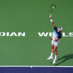 Denmark's Holger Rune hits a shot in his match against greece's Stefanos Tsitsipas on Tuesday. Rune stops Tsitsipas, reaches Indian Wells quarters