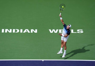 Denmark's Holger Rune hits a shot in his match against greece's Stefanos Tsitsipas on Tuesday. Rune stops Tsitsipas, reaches Indian Wells quarters