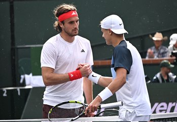 Denmark's Holger Rune (left) shakes hands with Greece's Stefanos Tsitsipas (right) on center court after their match on Tuesday. Rune stops Tsitsipas, reaches Indian Wells quarters