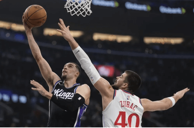 Sacrament Kings guard Zach Lavine (left) drives for a layup against LA Clippers center Ivica Zubac (right)in their game in Los Angeles on Sunday. Clippers vs Kings game has Leonard shot lead LA to win sans Lue