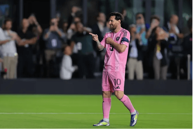 Inter Miami star Lionel Messi points his fingers in celebration at a match against Kansas in file photo. Houston Dynamo vs Inter Miami match a dud with Messi's absence