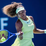 Japan's Naomi Osaka returns a shot in her opening match at the Miami Open on Tuesday. Osaka advances in Miami Open