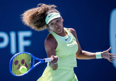 Japan's Naomi Osaka returns a shot in her opening match at the Miami Open on Tuesday. Osaka advances in Miami Open