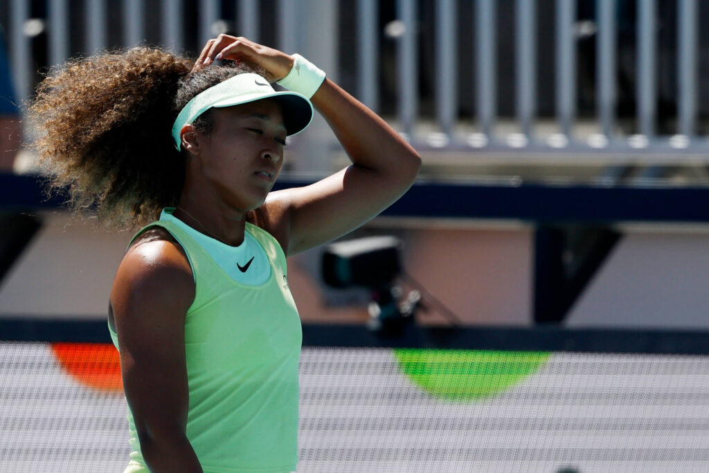 Japan's Naomi Osaka lingers during a short lull in her opening match at the Miami Open on Tuesday. Osaka advances in Miami Open