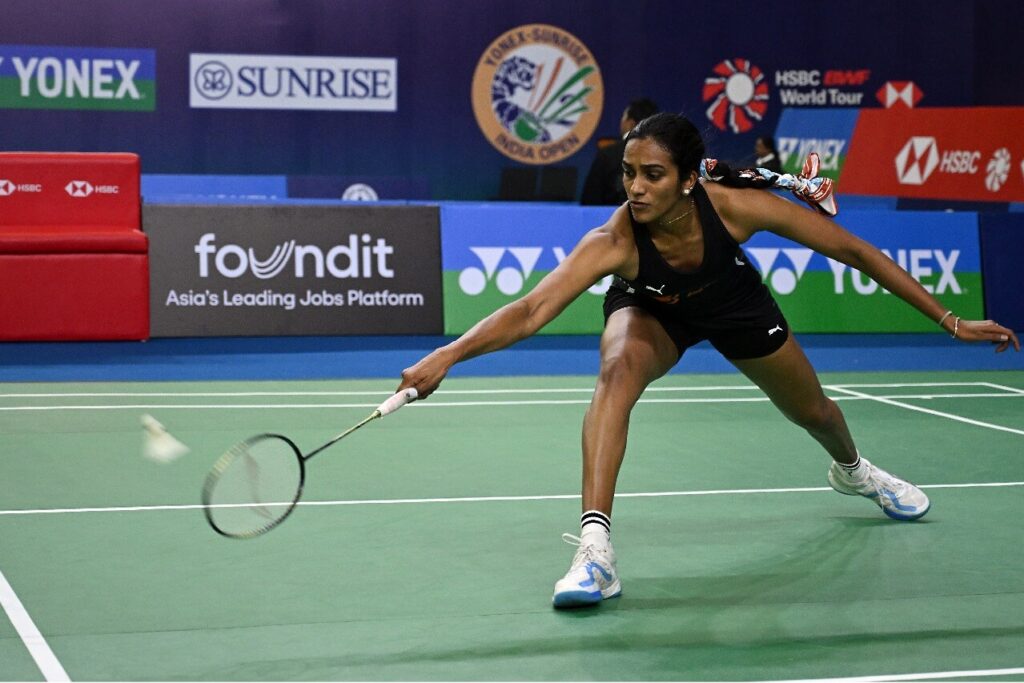 India's PV Sindhu slides to return a shot in file photo. Srikanth, Jun Hao advance in Swiss Open; Sindhu falls again