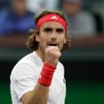 Greece's Stefanos Tsitsipas pumps his fist to celebrate a point in his match on Sunday. Tsitsipas advances at Indian Wells