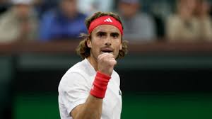 Greece's Stefanos Tsitsipas pumps his fist to celebrate a point in his match on Sunday. Tsitsipas advances at Indian Wells