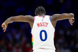 Philadelphia guard Tyrese Maxey (0) raises his arms while on t5he back of the camera in the first half of their ganme against Portland on Monday. 76ers vs Trail Blazers game leaves Maxey out