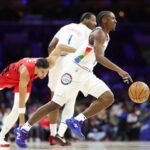 Philadelphia guard Tyrese Maxey (right0 dribbles the ball n the first half of their ganme against Portland on Monday. 76ers vs Trail Blazers game leaves Maxey out