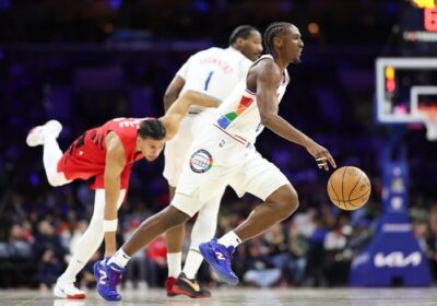 Philadelphia guard Tyrese Maxey (right0 dribbles the ball n the first half of their ganme against Portland on Monday. 76ers vs Trail Blazers game leaves Maxey out