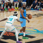 LA Clippers guard James Harden (blue, right) dribbles the ball as he devises a play against the Charlotte Hornets on Sunday. Clippers vs Hornets sees LA win 6 of last 7; Harden leads way