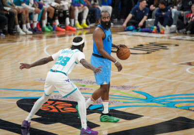 LA Clippers guard James Harden (blue, right) dribbles the ball as he devises a play against the Charlotte Hornets on Sunday. Clippers vs Hornets sees LA win 6 of last 7; Harden leads way