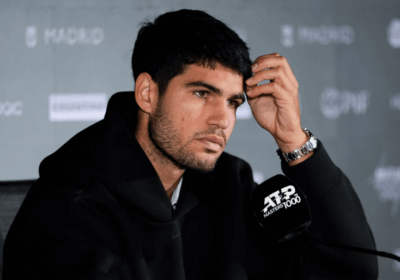 Spain's Carlos Alcaraz fields questions at a news conference in Madrid on Thursday. Alcaraz formally withdraws from Madrid Open