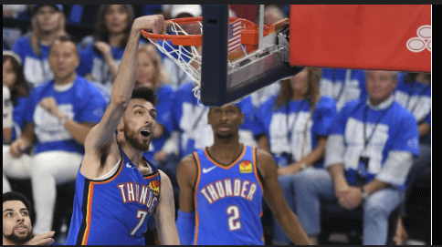 OKC forward Chet Holmgren (7,left) dunks the ball in Game 3 of their first round playoff series vs the Memphis Grizzlies on Thursday.