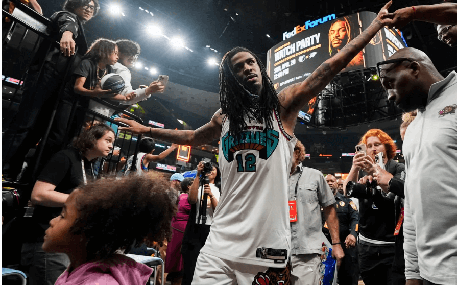 Grizzlies guard Ja Morant gives high fans to the Memphis home crowd after he fell hard on his hip following a tackle by OKC guard Lu Dort in Game 3 of their first round series on Thursday. Grizzlies vs Thunder saw Morant exit after fall