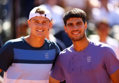 Denmark's Holger Rune (left) and Spain's Carlos Alcaraz (right) share the spotlight at the awards ceremony in Barcelona on Sunday. Rune stuns Alcaraz for Barcelona title