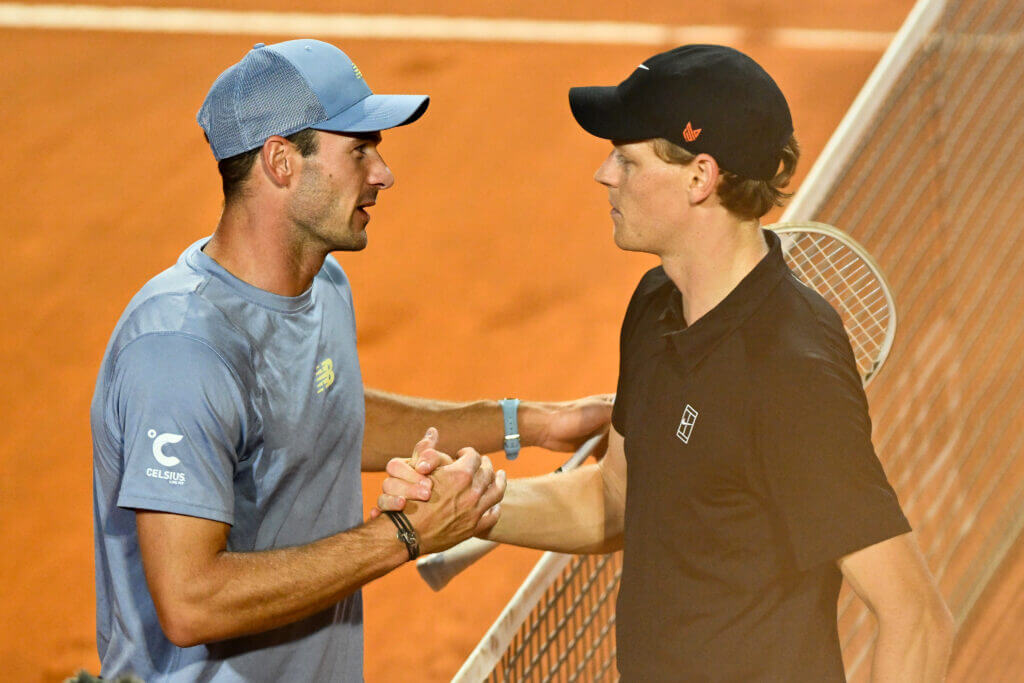 Italian Jannik Sinner (right) shakes hands with Spaniard Carlos Alcaraz (left) after their Italian Open 2025 men's singles final on Sunday. Sinner admits struggling in clay, seeks change in French Open