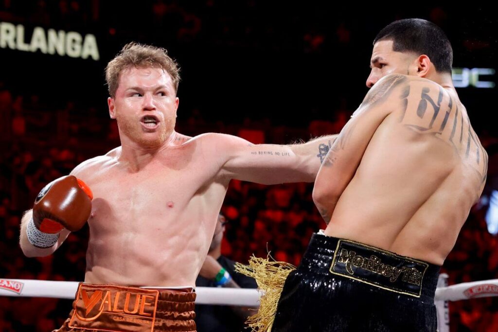 Mexico's Canelo Alvarez (left_ makes a left hand punch againt William Scull in their Cinco de Mayo fight recently. Canelo set to become USD1 billion boxer in 2026, says manager