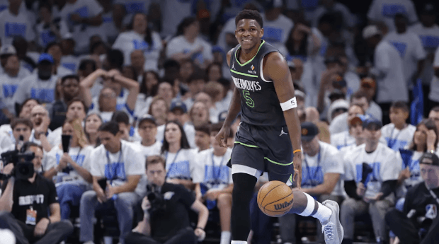 Minnesota guard Anthony Edwards dribbles the ball while smiling in Game 1 of their Western Conference Finals against the Oklahoma City Thunder on Tuesday. Thunder vs Timberwolves sees OKC take Game 1 with big win