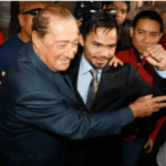 Top Rank executive Bob Arum (left) joined Manny Pacquiao (right) at a formal event in file photo. Arum finds Pacquiao comeback title fight 'really questionable'
