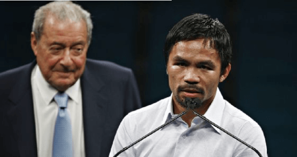 Top Rank executive Bob Arum (left) listens as boxer-turnes-politician Manny Pacquiao (right) fields questions at a news conference in file photo. Arum finds Pacquiao comeback title fight 'really questionable'