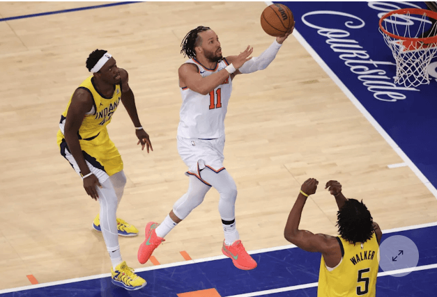 New York pointguard Jalen Brunson (11, right) drives for a layup against the Indiana Pacers in Game 5 of their Eastern Conference finals series on Thursday. Knicks vs Pacers series sees New York force Game 6