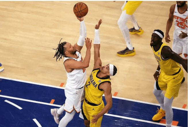 New York Knicks guard Jalen Brunson (left) shoots over Andrew Nembhard (2, right) of Indiana in game 1 of their Eastern Conference Finals series in New York on Wednesday. Knicks vs Pacers series has Indiana drawing first blood in OT