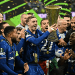 Chelsea midfielder Cole Palmer (middle) holds the trophy as they celebrate the Blues victory over Real Betis on Wednesday. Real Betis vs Chelsea saw Blues claim UEFA Conference League