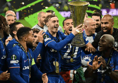Chelsea midfielder Cole Palmer (middle) holds the trophy as they celebrate the Blues victory over Real Betis on Wednesday. Real Betis vs Chelsea saw Blues claim UEFA Conference League