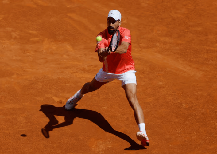 Serbian Novak Djokovic hits the ball in practrice ahead of his stint at the Geneva Open 2025. Djokovic in no rush to find permanent coach as French Open nears