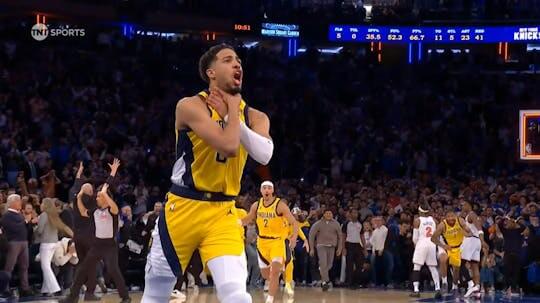 Indiana Pacers guard Tyrese Haliburton shows the "choke" sign on his neck in celebration in Game 1 of the Pacers vs Knicks series on Wednesday in New York. Knicks vs Pacers series has Indiana drawing first blood in OT