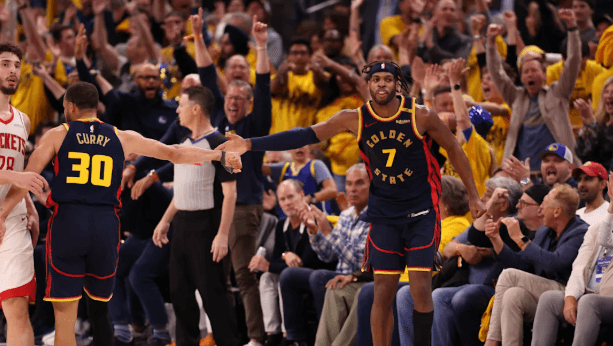 Golden State guard Buddy Hield (7, right) gets a high five from teammate Stephen Curry (30, left) after draining s 3-pointer in Game 7 of their first round serives in Houston on Sunday. Rockets vs Warriors sees Hield lead Dubs to Game 7 win