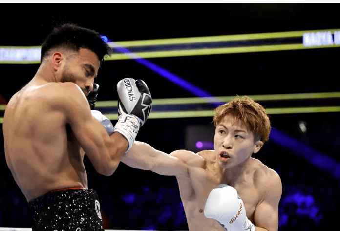 Japan's Naoya Inoue (right_ peppers American Ramon Cardenas with flurry of punches in their matchup in Las Vegas on Sunday night. Inoue survives knockdown to stop Cardenas in Las Vegas return