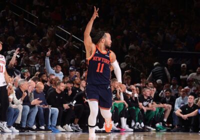New York guard Jalen Brunson raises his fingers signalling a 3-pointer against the Boston Celtics in Game 4 of their first-round series on Monday. Knicks vs Celtics shows New York get 3-1 lead; Tatum injured