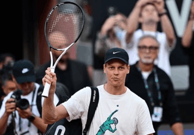 Italy's Jannik Sinner waves to the crowd as he raised his racquet after his first public practice in Rome for the Italian Open 2025. Sinner to return at Italian Open; Djokovic withdraws amid skid