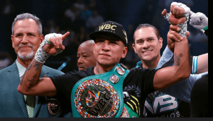 WBC welterweight champion Mario Barrios (middle) poses with his title belt at a recent fight in file photo as his name has been linked to retired star Manny Pacquiao. Pacquiao to come out of retirement, eyes Barrios' title: reports