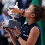 Italy's Jasmine Paolini kisses her trophy after winning the women's singles final over American Coco Gauff on Saturday. Paolini to move up to No.4 in WTA rankings after Italian Open win