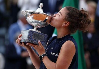 Italy's Jasmine Paolini kisses her trophy after winning the women's singles final over American Coco Gauff on Saturday. Paolini to move up to No.4 in WTA rankings after Italian Open win