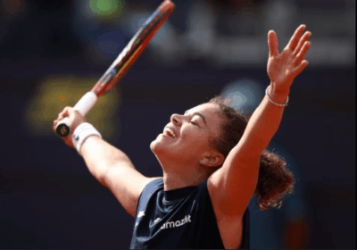 Italy's Jasmine Paolini raises her arms in celebration after her semifinals match against Peyton Stearns in Rome on Thursday. Paolini reaches Italian Open final vs Gauff; Sinner, Musetti in semis