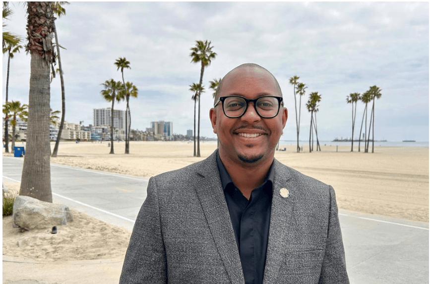Mayor Rex Richardson poses with the background of Long Beach featured in file photo. LA2028 Games to showcase Long Beach as host to 11 events