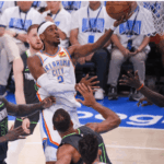 OKC guard Shai Gilgeous Alrexander drives for a layup against two Minnesota defenders in Game 1 of their Western Conference Finals on Tuesday. Thunder vs Timberwolves sees OKC take Game 1 with big win