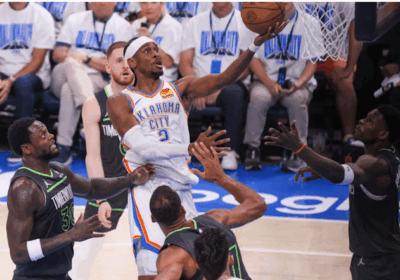 OKC guard Shai Gilgeous Alrexander drives for a layup against two Minnesota defenders in Game 1 of their Western Conference Finals on Tuesday. Thunder vs Timberwolves sees OKC take Game 1 with big win