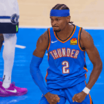 OKC guard Shai Gilgeous Alexander flexes his muscles in Game 2 of their Western Conference Finals series against the Minnesota Timberwolves on Thursday. OKC vs Wolves Game 2 sees Thunder take 2-0 lead behind SGA