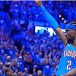 OKC guard Shai Gilgeous Alexander raises his right arm to acknowledge the crowd after taking a shot in Game 7 of their Western Conference semifinals vs the Denver Nuggets on Sunday. Nuggets vs Thunder sees OKC in West finals against Wolves