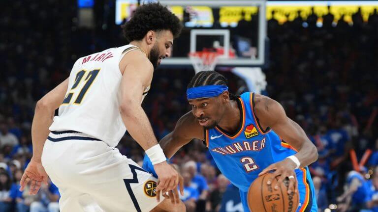 OKC guard Shai Gilgeous Alexander (right) drives to the basket against Denver guard Jamal Murray (21, left) in Game 7 of their Western Conference semifinals vs the Denver Nuggets on Sunday. Nuggets vs Thunder sees OKC in West finals against Wolves