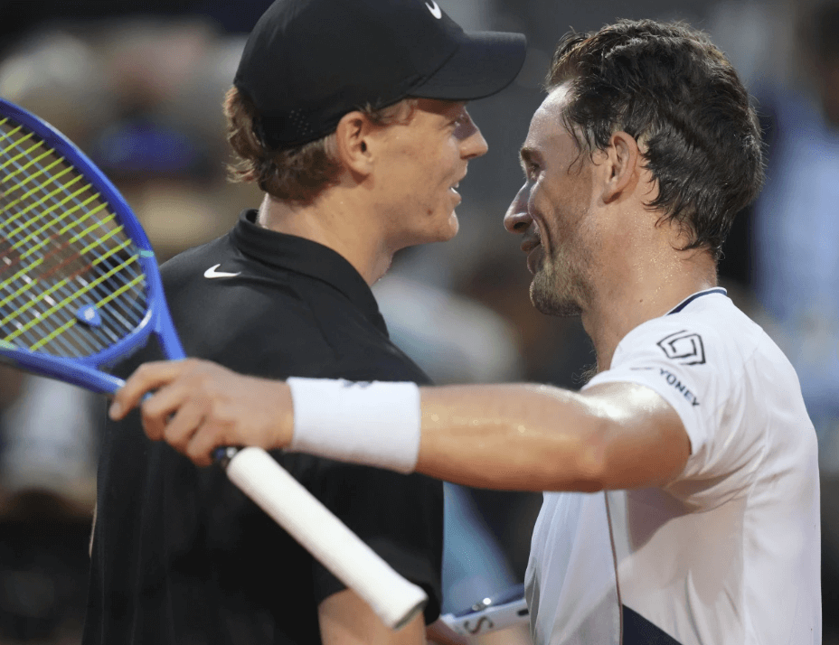 Italy's Jannik sinner (left) and Norway's Casper Ruud (right) shake hands at enter court after their quarterfinals match in Rome on Thursday. Paolini reaches Italian Open final vs Gauff; Sinner, Musetti in semis